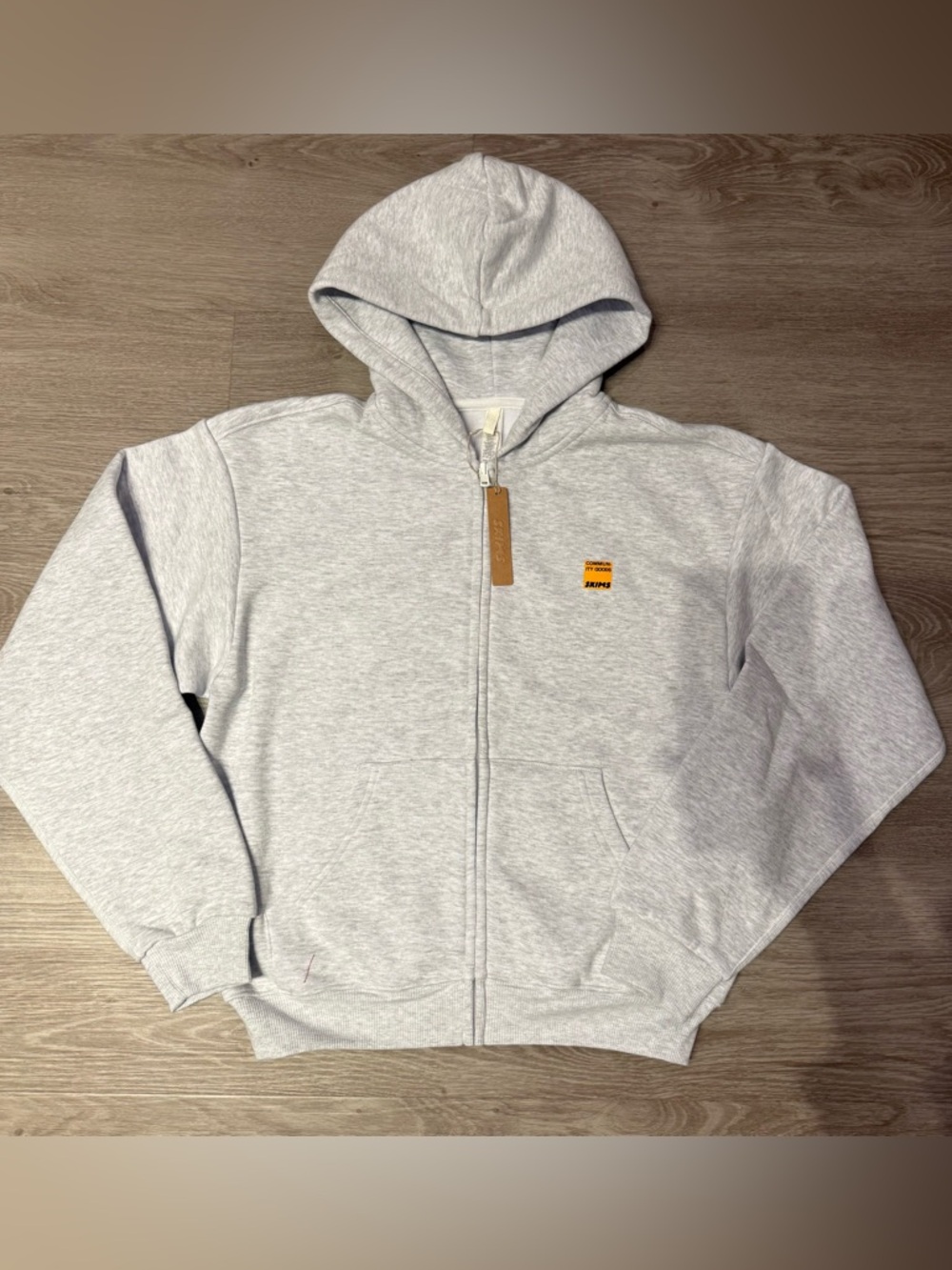 skims community goods zip up